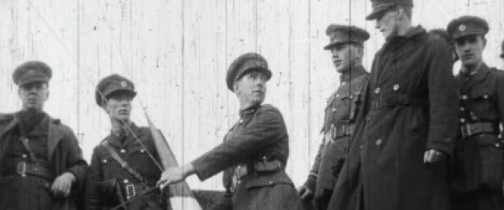 Sean Mac Eoin raising the tricolour at Athlone Barracks some time before the shooting of the sentry McEvaddy