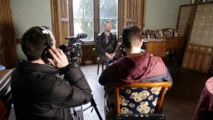 Behind the scenes still of me reading Out of Tune in Charleville Castle