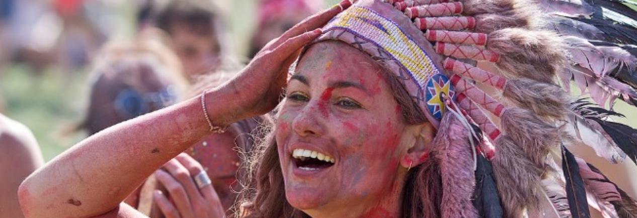 Skin painted red, wearing feather headdress, this girl at Glastonbury is as offensive to Native Americans as blacking up pretending to be African would be