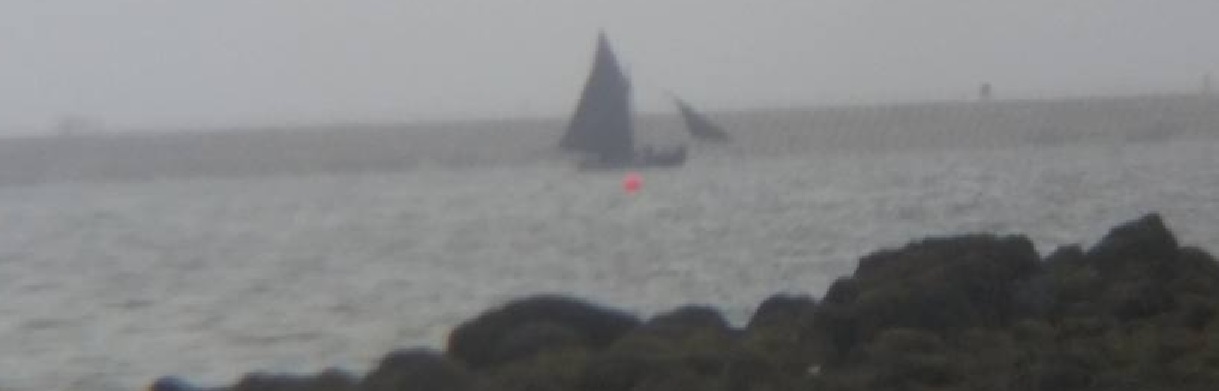 Galway Hooker sailing into Claddagh Bay seen from Renmore