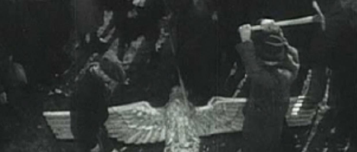 Smashing the Nazi Eagle statue in Mauthausen Concentration Camp in Austria